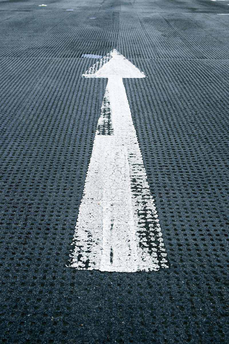 united kingdom painted arrow sign on floor arrow